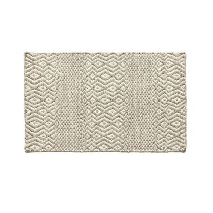Field, una alfombra tejida a mano con un patrón que se hace grande y pequeño de Kuatro Carpets en color grey